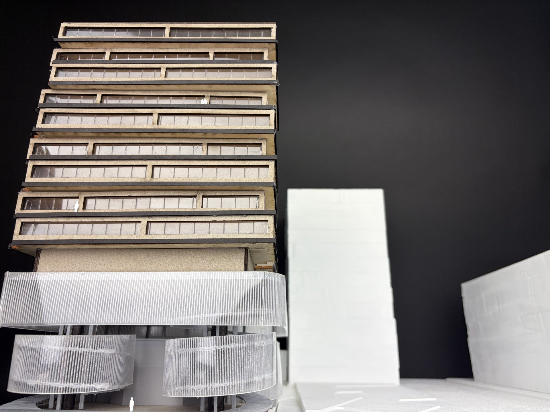 Frontal view of the Chicago Theatre and Film School study model, showing the full height of the layered dorm and classroom volumes above the theatre base