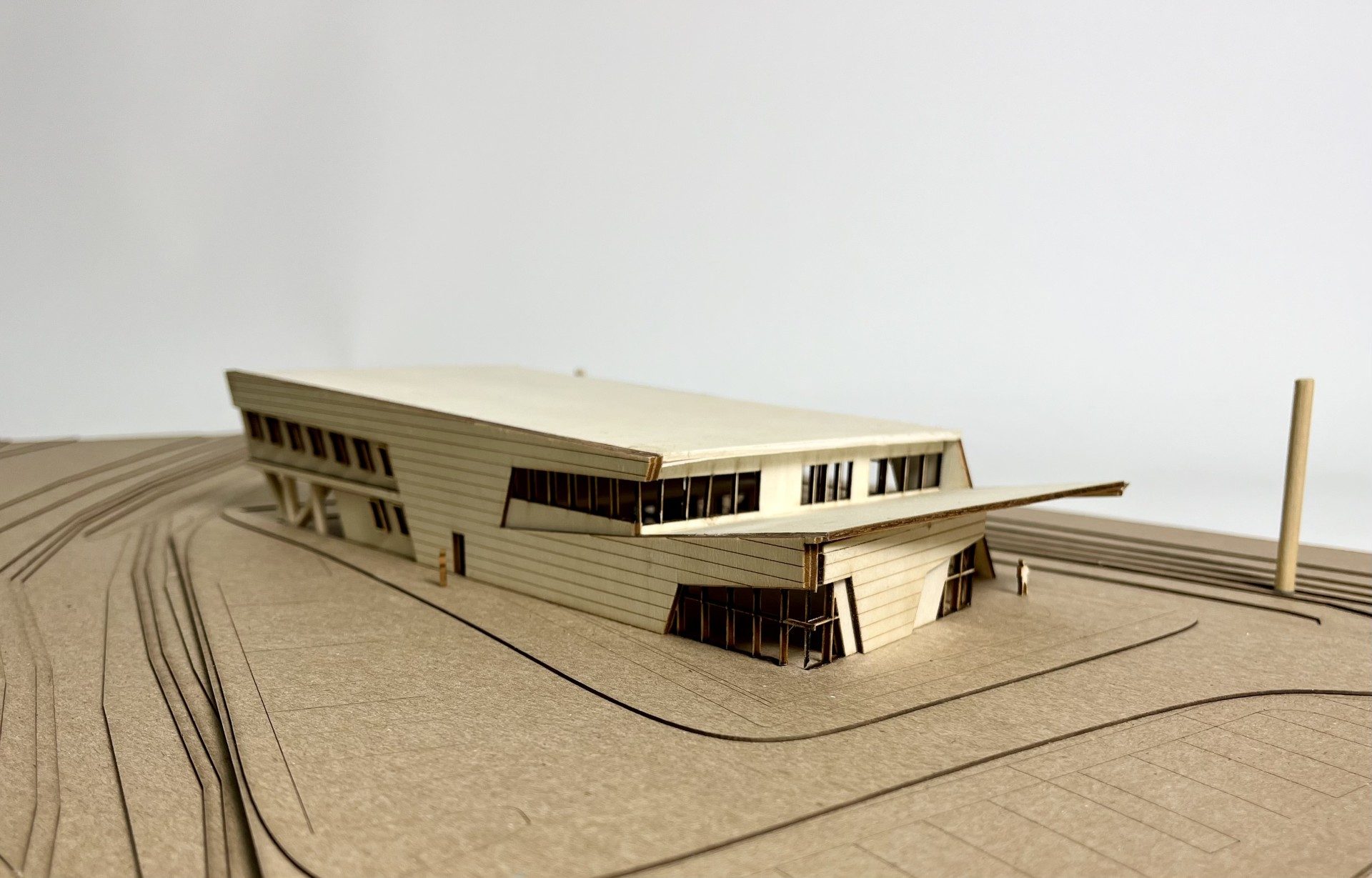 Three-quarter angled view of the LSU Campus Health Center study model within its sloped site context